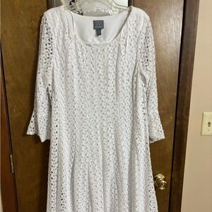 White lace dress with white shell underneath. Only wore a couple of times.